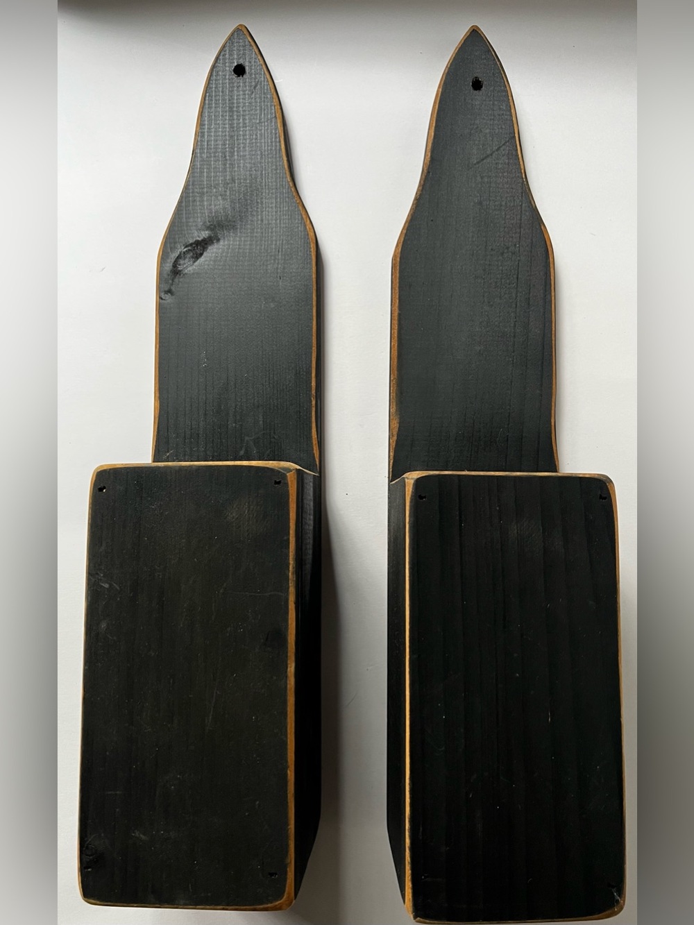 Set of two primitive style wooden wall pockets